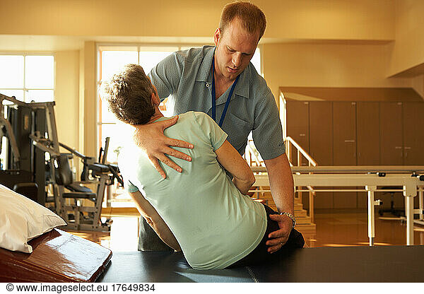 Physical therapist working with mature woman