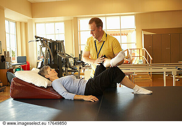 Physical therapist working with patient