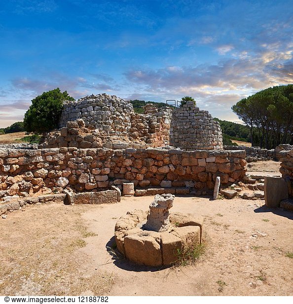 Pictures and image of the exterior ruins of Palmavera prehistoric Nuragic village meeting hall with Nuraghe tower behind,  archaeological site,  middle Bronze age (1500 BC),  Alghero,  Sardinia.