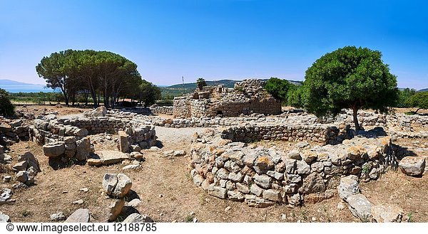 Pictures and image of the exterior ruins of Palmavera prehistoric round walled Nuragic village houses with its Nuraghe tower behind  archaeological site  middle Bronze age (1500 BC)  Alghero  Sardinia.