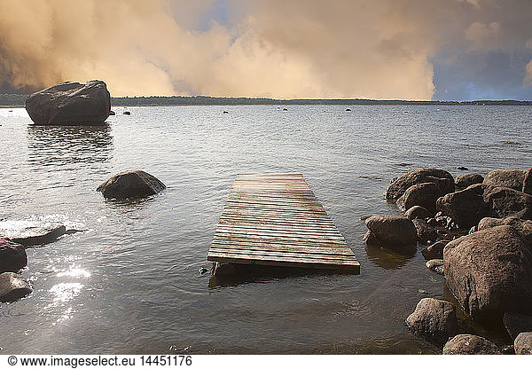 Pier Floating on a Rocky Shore