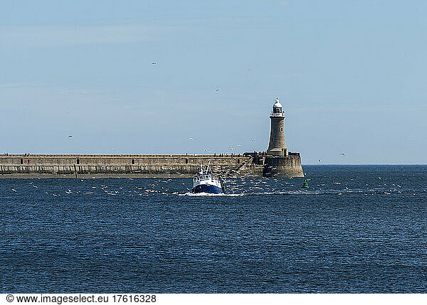 Pier with lighthouse and boat on the River Tyne; South Shields  Tyne and Wear  England