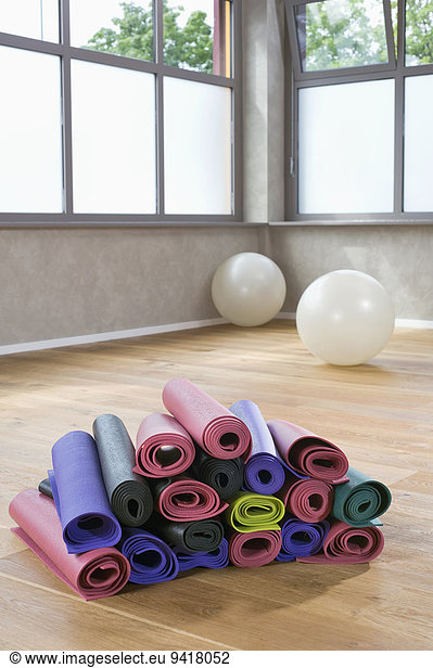 Pile of colorful Yoga mats in Yoga Studio