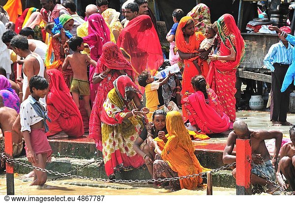 Pilgrims praying and bathing at Har Ki Pairi ghat by the Ganges River
