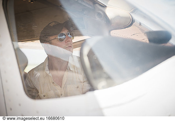 Pilot looking out cockpit window