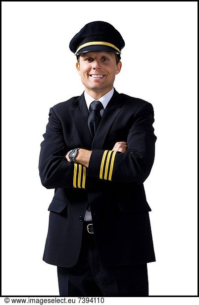 Pilot standing with arms crossed smiling