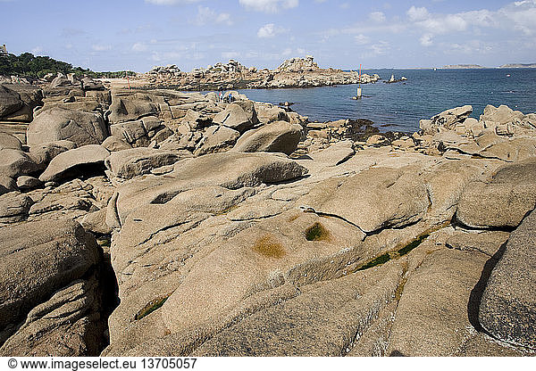 Pink granite rocks  eroded into various shapes  line the northern Breton coast of France near Ploumanac'h. Cote de Granit Rose  Brittany  France.