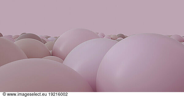 Pink spheres over colored background