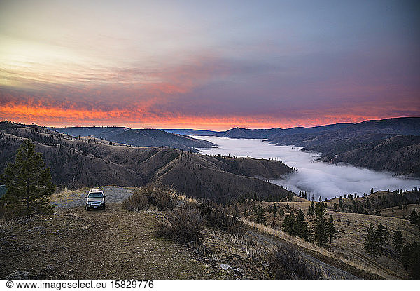Pink Sunrise In The Mountains With Clouds in The Valley