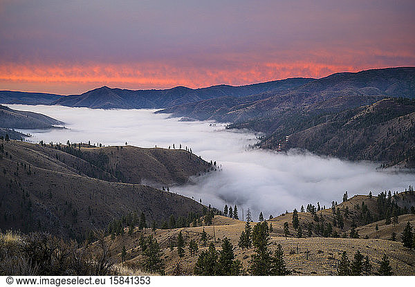 Pink Sunrise In The Mountains With Clouds in The Valley