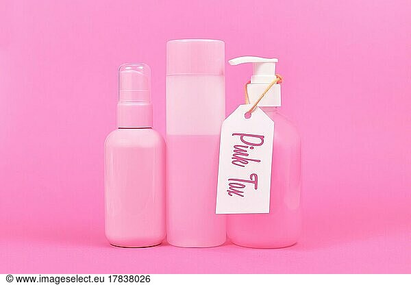 Pink tax concept with various stereotype pink colored hygiene products marketed to women