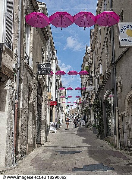 Pink umbrellas in the air  in the Rue du Commerce  Blois  Département Loire-et-Cher  Centre-Val de Loire  France  Europe