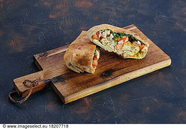 Pita bread stuffed with chicken  tomato and omelette