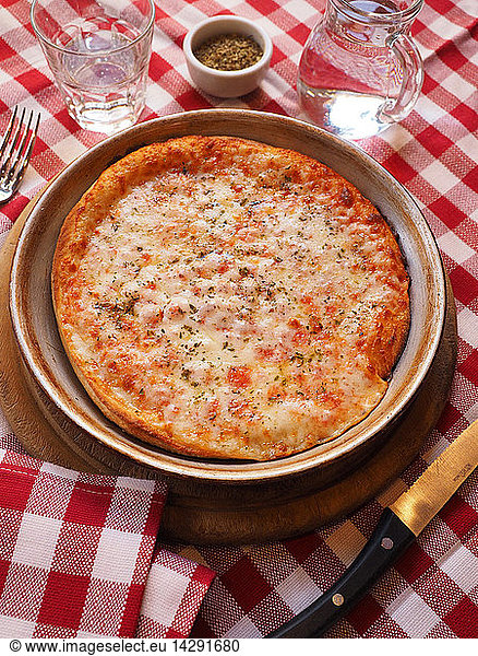 Pizza margherita  with mozzarella cheese  tomato sauce and oregano  Italy
