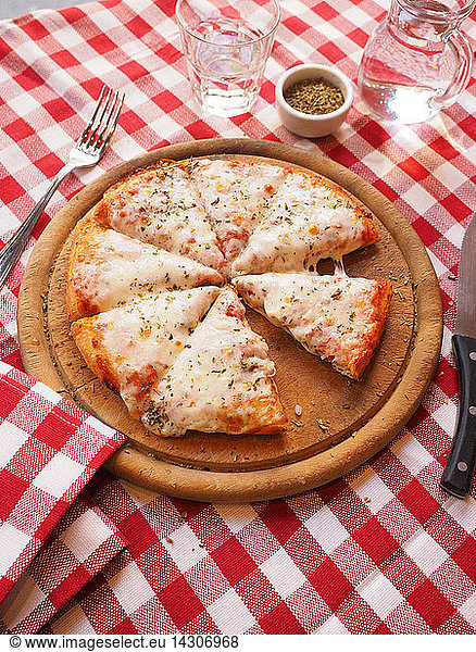 Pizza margherita  with mozzarella cheese  tomato sauce and oregano  Italy