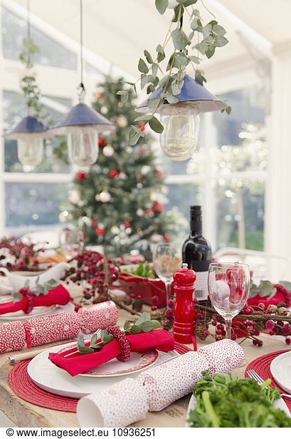 Placesetting and Christmas decorations on dining table