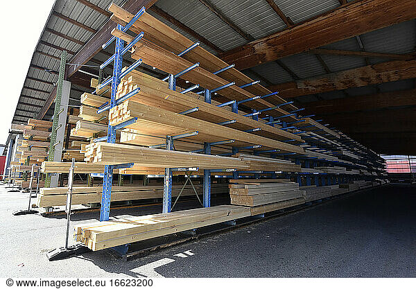 Planks stored on warehouse rack