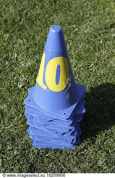 Plastic cones on sports field,  close-up