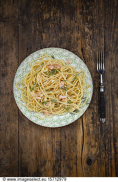 Plate of spaghetti with salmon and dill