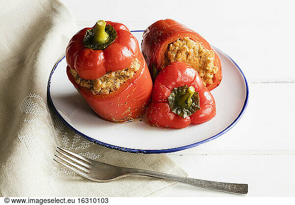 Plate of stuffed bell peppers with spelt