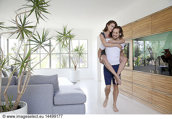 Playful Couple in Modern Living Room