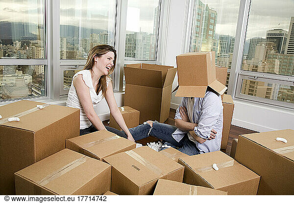 Playful Couple With Boxes