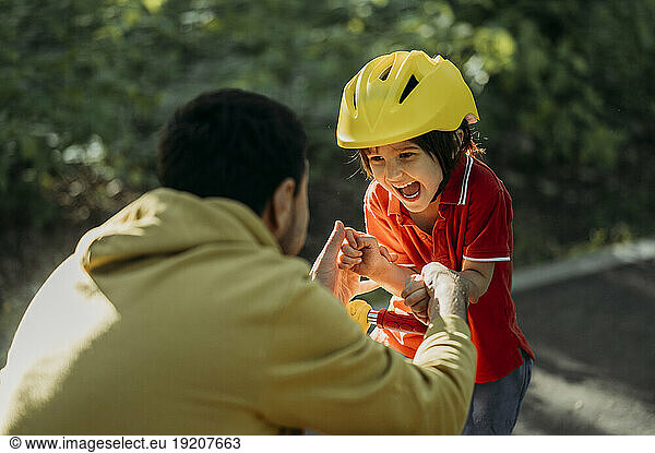 Playful father and son having fun