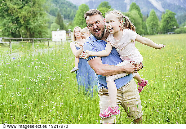Playful father with daughter enjoying vacation