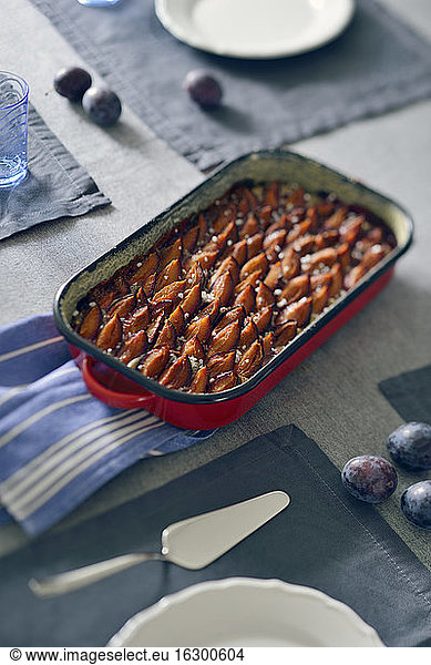 Plum cake in casserole dish