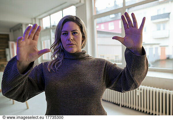 Plus size businesswoman doing hand gestures in office