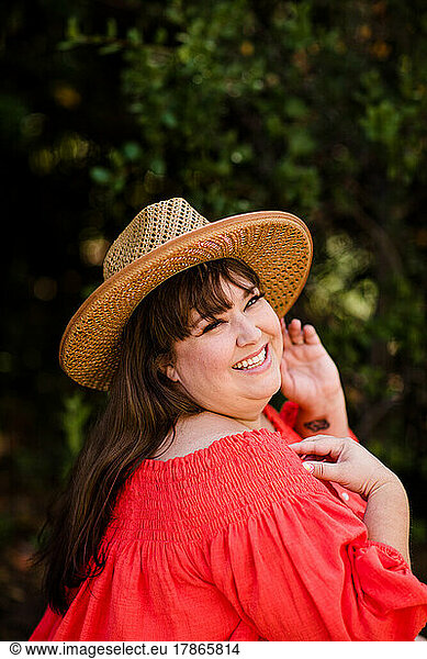 Plus Size Model Wearing Off the Shoulder Blouse & Hat in San Diego