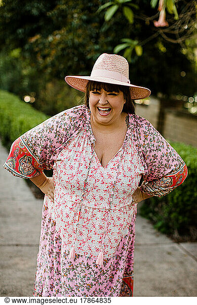 Plus Size Woman Modeling Dress & Hat in San Diego