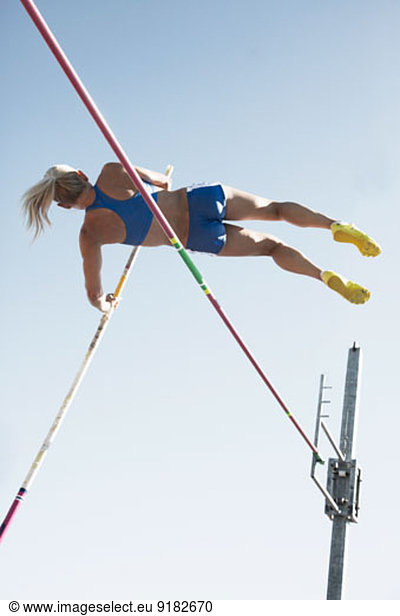 Pole vaulter clearing bar