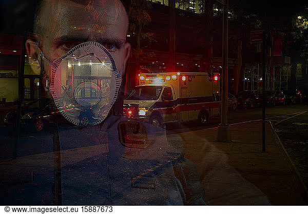Policeman wearing face mask  watching over NYC  USA  multiple exposure