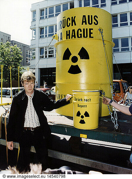 politics  international organisations  Greenpeace  actions  action against recycling of German nuclear waste in La Hague  France  activist Gero Luecking with a barrel in front of the Bavarian Ministry of the Environment  Munich  18.7.1997