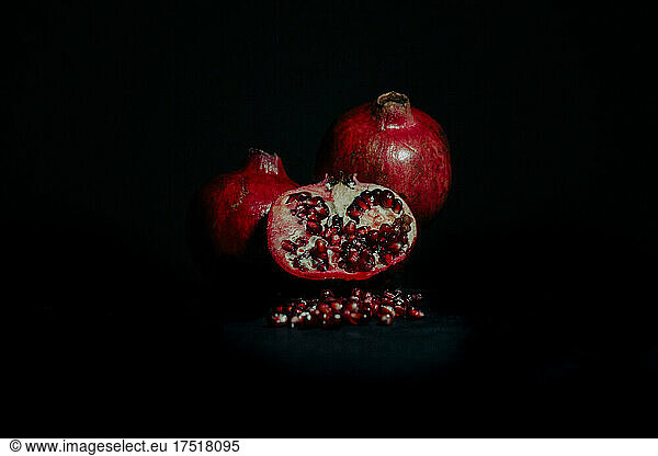 Pomegranates on a black table