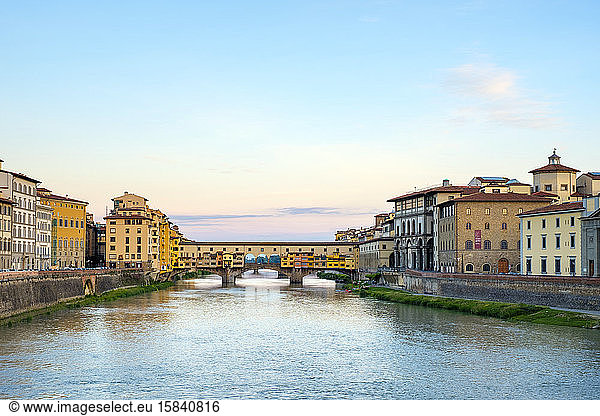 Ponte Vecchio on the Arno river and buildings in old town at sunrise  Florence (Firenze)  Tuscany  Italy