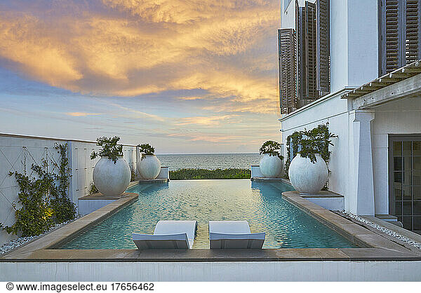 Pool with Waterfront view at Sunset