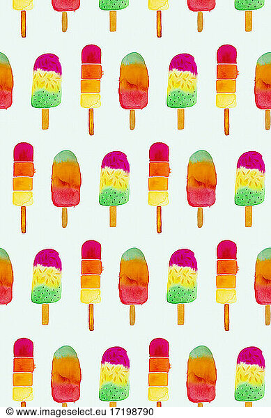 Popsicle Stick Ice Creams painted on mint green paper