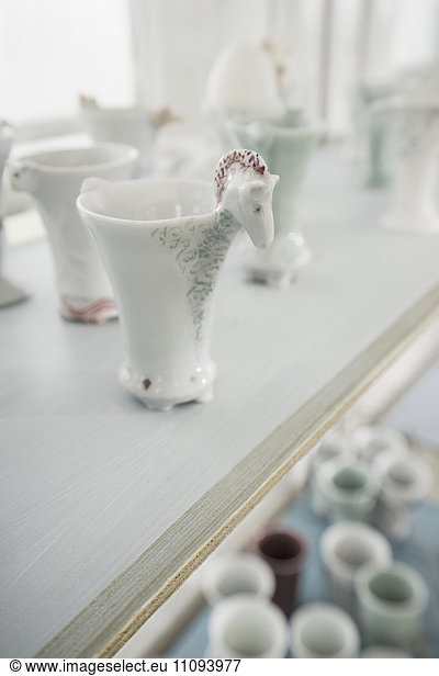Porcelain vases on shelf in a glass house  Bavaria  Germany
