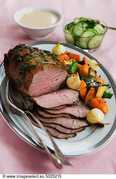 Pork fillet with vegetables on plate  close-up