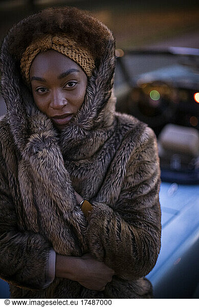 Portrait beautiful young woman in fur coat