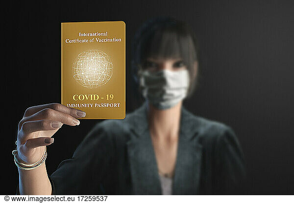 Portrait businesswoman showing Covid immunity passport
