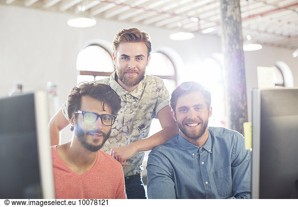 Portrait casual businessmen smiling in office