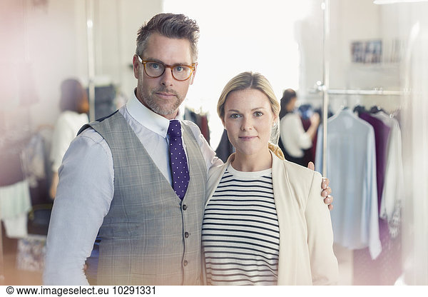 Portrait confident fashion designers in office