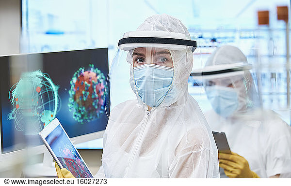 Portrait confident female scientist researching coronavirus