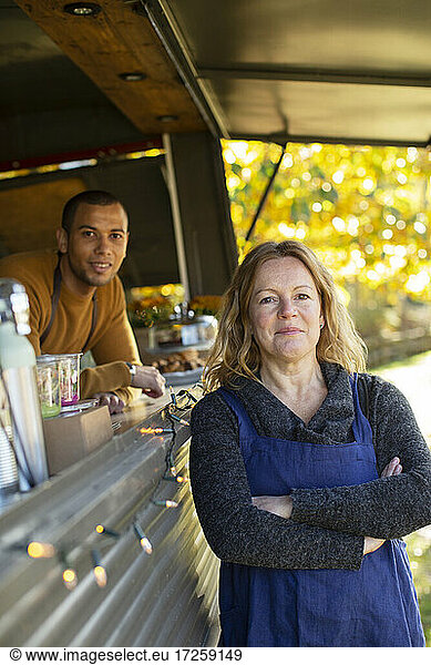 Portrait confident food truck owners