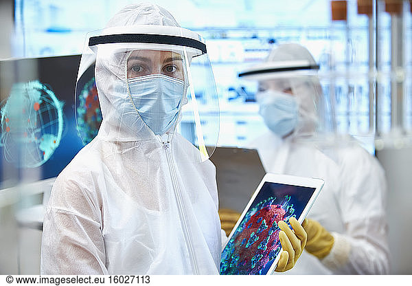Portrait female scientist in clean suit researching coronavirus