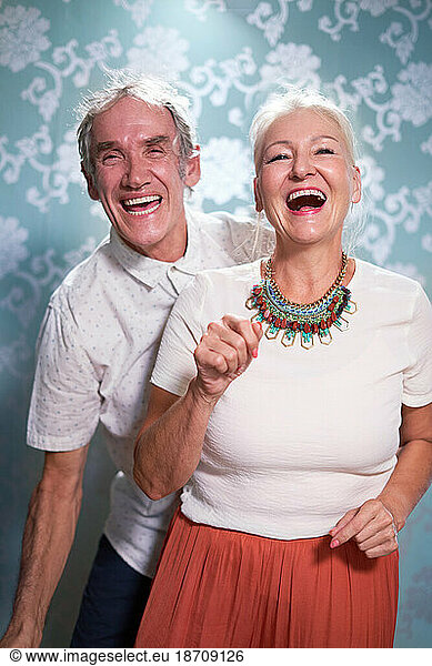Portrait happy  carefree senior couple dancing