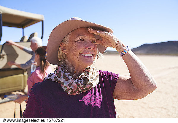 Portrait happy senior woman on safari